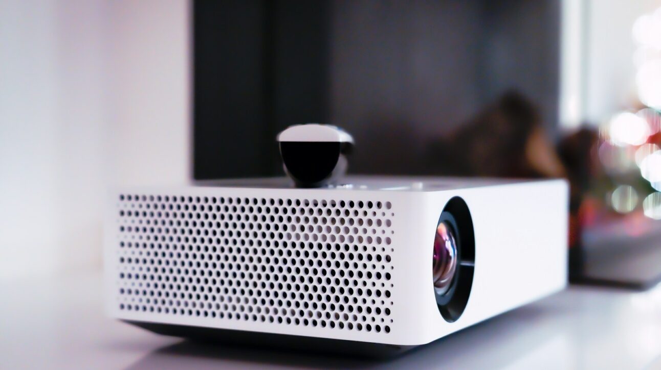 black and white projector on white table