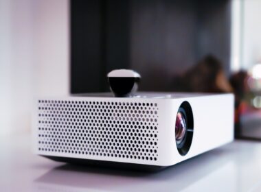 black and white projector on white table