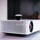 black and white projector on white table
