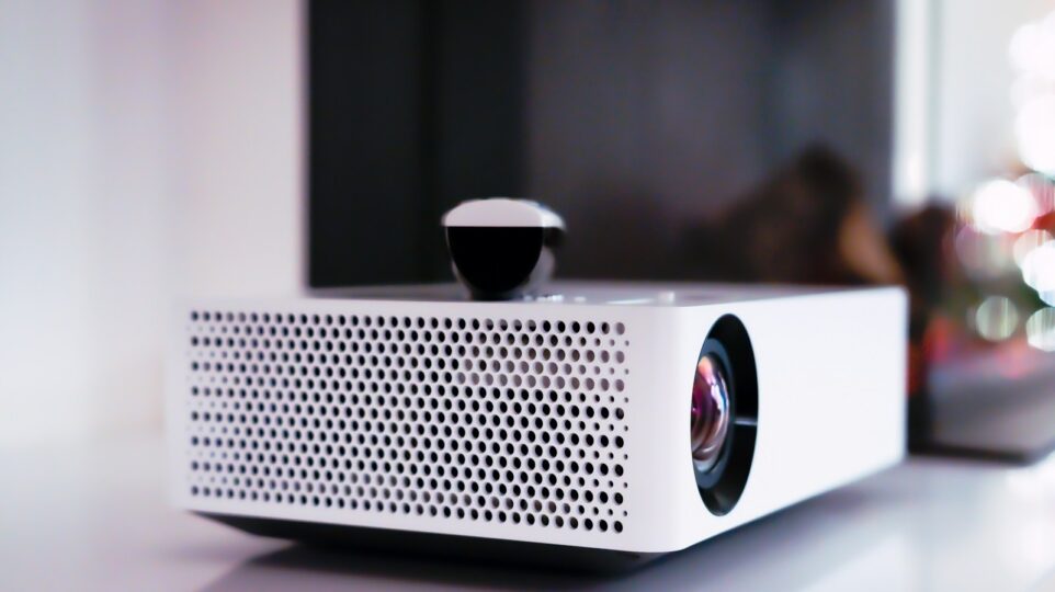 black and white projector on white table